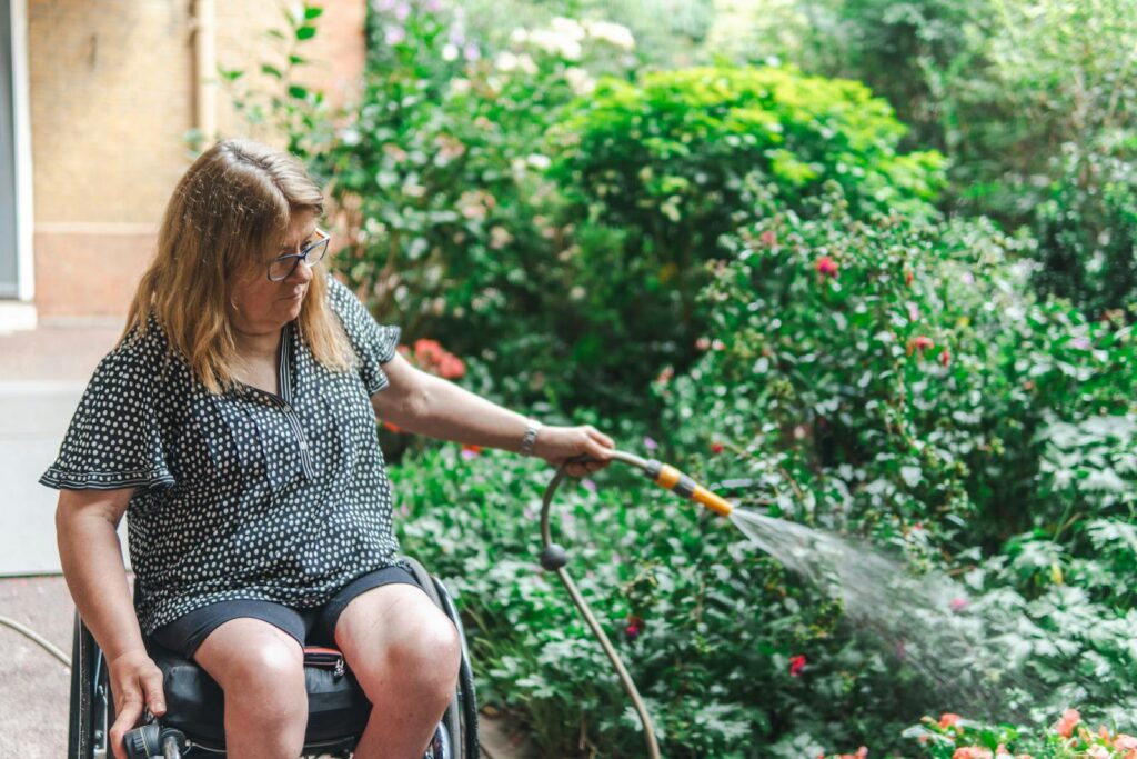 Older woman watering her plants